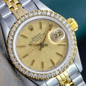 ROLEX LADIES DATEJUST GOLD STEEL CHAMPAGNE LINEN DIAL DIAMOND BEZEL 26MM WATCH